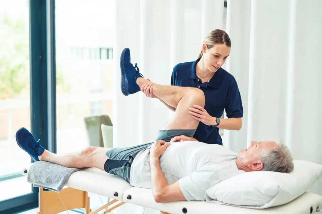 Revitalising Recovery: Effective Rehabilitation Strategies for Muscle Injuries 3 Physiotherapist assisting a patient with muscle recovery exercises Devizes