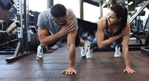 Image of man and woman doing Cardio Devizes to tone their arms. 